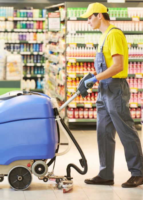 Floor care and cleaning services with washing machine in supermarket shop store